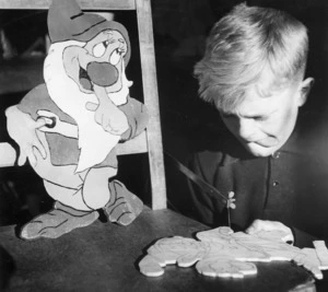 School boy working on Walt Disney characters from "Snow White and the Seven Dwarfes"