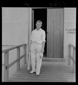 Cricketers at the Basin Reserve with an unidentified man with bat and pads ready to play, Wellington City