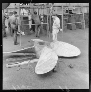 Replacement propeller for a Russian Whaling Ship in an unknown dry dock location with unidentified workmen, Wellington Region