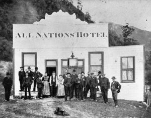 Group standing outside the All Nations Hotel in Barrytown, West Coast