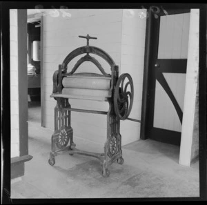 Interior view showing antique clothes press at Riddiford Estate, Woburn, Lower Hutt