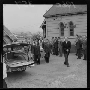 Preston funeral with unidentified men carrying the coffin and people paying their respects at an unknown church, Wellington