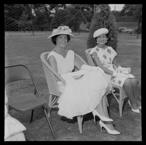 Government House garden party with two unidentified women sitting in front of the tennis courts, Wellington City