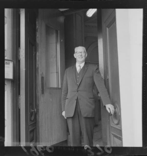 BNZ Te Aro Branch Manager Mr Hollaway standing in the doorway of his Bank, Wellington City