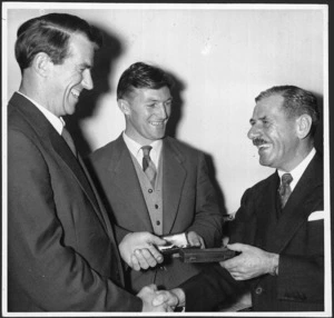 Sir Edmund Hillary and Mr J H Miller receiving IWC watches