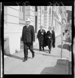 Chief Justice, Sir Harold Barrowclough (left) and Registrar, G R Holder being escorted by Constable W J Firmin to the new Court of Appeal, Ballance Street, Wellington