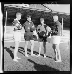 C G Gibbons coach/selector with ball and Wellington players J R Watt, I N MacEwan and R W Caulton at Athletic Park prior to South African tour
