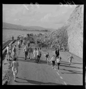 Slip at Eastbourne, Wellington Region, showing people having a look at the damage