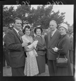 Garden party at Homewood with five unidentified people in front of trees, Karori, Wellington