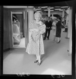 Fashion Parade at Kirkcaldie and Stains with an unidentified older woman model in an evening dress and fur stole, Wellington City