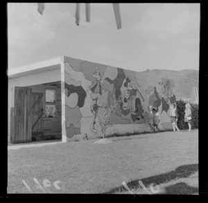 Mural on a garage of the Disney characters Goofy, Mickie Mouse, Pluto and Donald Duck with young children looking on, [Hutt Valley?], probably Wellington Region