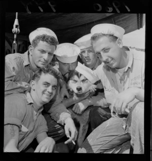 Unidentified visiting United States sailors with their dog and mascot, possibly Wellington Wharves