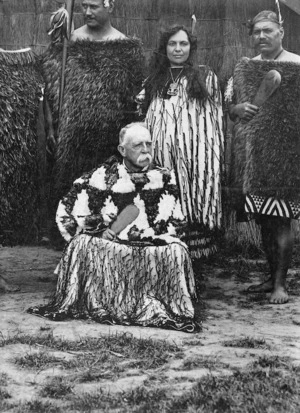 Gilbert Mair draped in two Maori cloaks at the Christchurch Exhibition