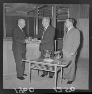 Mr H R H Chalmers, farewelling Mr A C Peters, handing out a silver tea set as a gift, probably Wellington Region