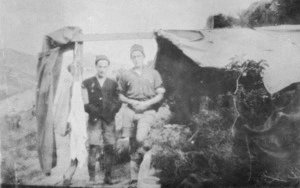 Two New Zealand soldiers beside a shelter, Gallipoli, Turkey