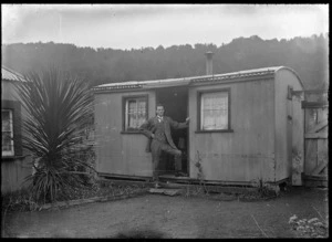 Bach at Ohakune, with William Godber standing in the doorway, circa 1924.