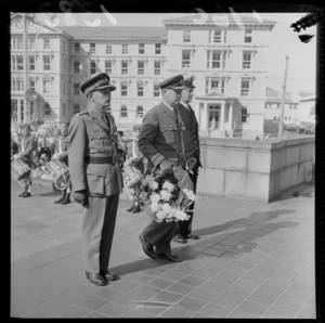 Saint Patrick's Old Boy military officers laying a wreath at the Cenotaph War Memorial on Lambton Quay in front of Parliament on [ANZAC Day?], Wellington City