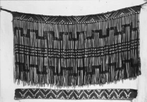 Maori flax skirt (piupiu) and a length of taniko weaving, probably at Koroniti
