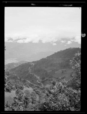 Yunnan, China. View of the Burma Road zigzagging down to Yang-pi. 9 September 1938