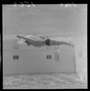 Peter Hatch, demonstrates swimming techniques at Naenae baths, Naenae, Lower Hutt, Wellington