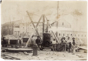 Creator unknown : Photograph of workmen and steam boiler at a building site