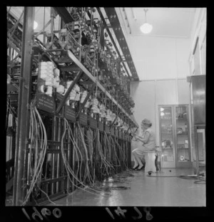 Unidentified women, repairing the wiring of the Totalisator machine, Trentham Racecource, Lower Hutt, Wellington