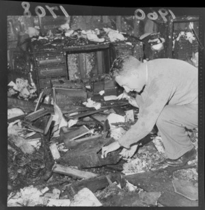 Unidentified man inspecting property, during a fire at St Augustine's Church, Petone, Wellington Region