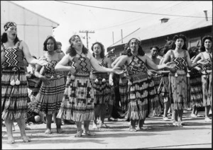 Wanganui Maori women performing a traditional action song, welcoming the Maori Battalion home
