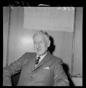 Portrait of Sir Walter Cooper, Australian Minister of Repatriation, within an unknown building location [possibly the Waterloo Hotel], probably Wellington City