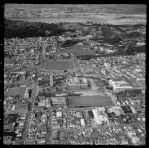 View east over the Wellington City suburb of Mount Cook with Wellington High School, the War Memorial, Museum and the Basin Reserve, to Wellington (Boys) and East Girls Colleges and the Mount Victoria tunnel