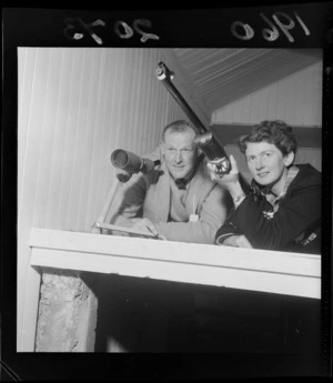 Unidentified man and woman at the Small Bore Rifle Association North Island versus South Island competition