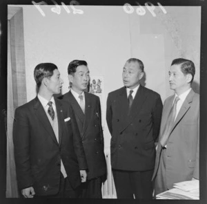 Portrait of four unidentified Japanese Cotton Exporter delegates within an unknown building location, probably Wellington City