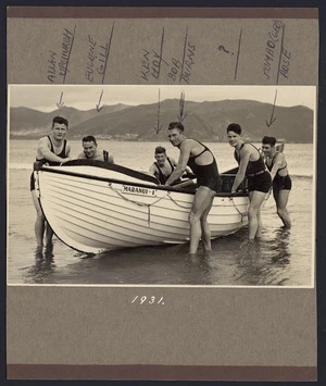 Group of men with a Maranui Surf Life Saving Club boat