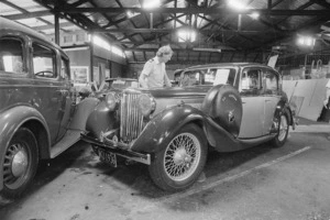 AA officer Brian Bannister looking at a restored 1936 Jaguar SS - Photograph taken by Merv Griffiths