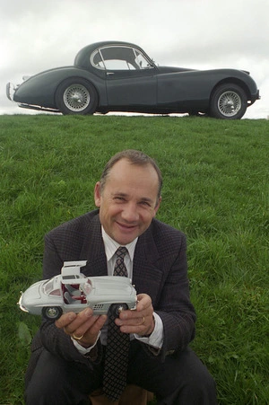 David Wright with a Jaguar XK120 and holding a model of a gull-winged Mercedes - Photograph taken by Melanie Burford