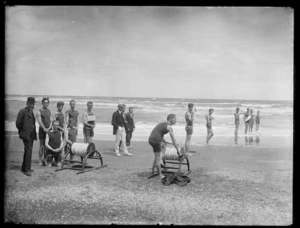 Creator unknown :Photograph of surf lifesavers on a beach