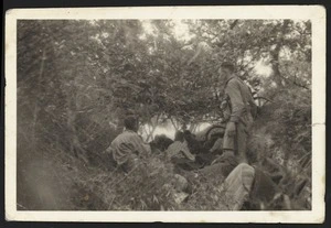Wounded soldiers hiding in a ditch, Crete, during World War II