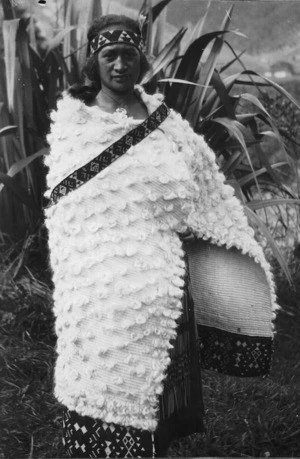Woman wearing a cloak made from fine flax fibre