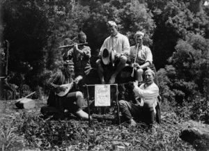 Five men playing musical instruments