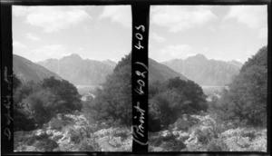 View of Mt Cook and The Hermitage Hotel, partly obscured by trees, Aoraki/Mt Cook National Park, Canterbury region