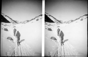 Unidentified skiers, walking through the snow, Mount Cook National Park, Canterbury Region
