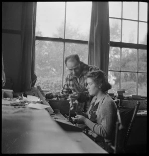 Woman making fishing flies, Turangi