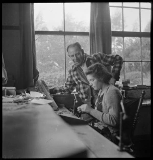 Woman making fishing flies, Turangi