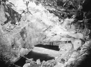 Hinge, Leslie 1868-1942 :The quarry floor from which the large column stones were cut [Kairuru Quarry, Takaka Hill]