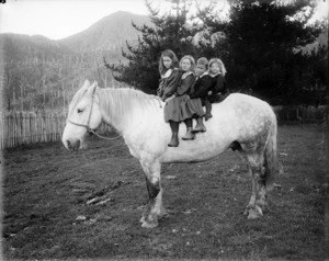 The Brown children of Murchison upon a horse