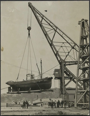 Floating Crane `Hikitia' lifting the Uta into the water from the breastwork at Thorndon, Wellington Harbour