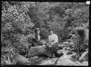 Ethel Haggitt, and possibly Gertie Tewsley, by a stream