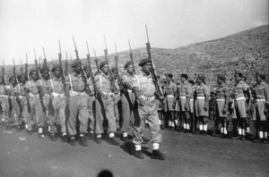 Murphy, J, fl 1945 (Photographer) : Guard of Honour from the Maori Battalion, marching in the Memorial Service in Crete, in honour of the men who died there in 1941