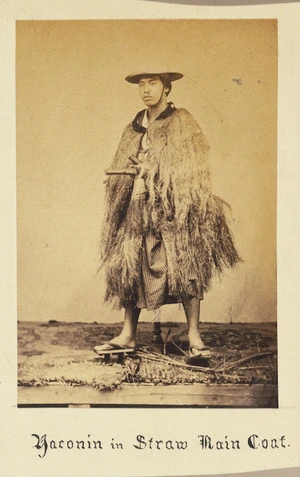 Japanese man in straw rain coat