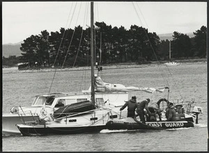 Rescued yacht Cavalier III with the Nelson Coastguard inflatable dinghy alongside, Nelson Harbour - Photograph taken by R Lucas & Son (Nelson Mail) Ltd